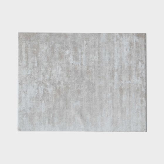 Modern rectangular area rug with textured grey and beige pattern on white background