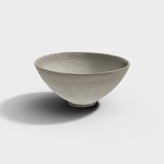 White ceramic bowl with textured surface and small base on white background