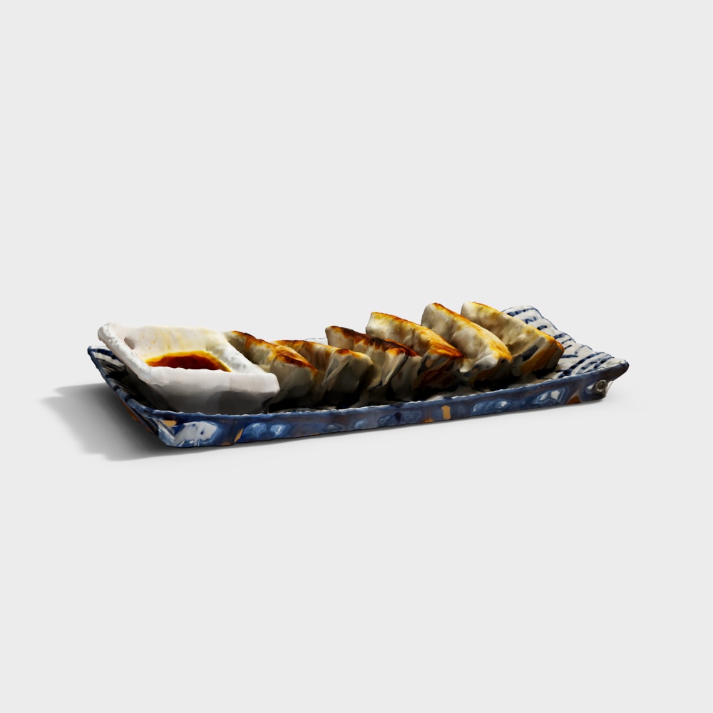 Pan fried dumplings on blue ceramic plate with dipping sauce bowl on white background