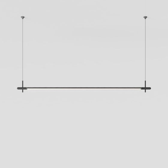 Modern black metal hanging light fixture with long white tube on grey background