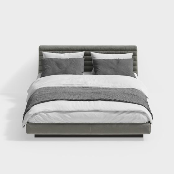 Modern grey upholstered bed with white bedding and pillows on light grey background