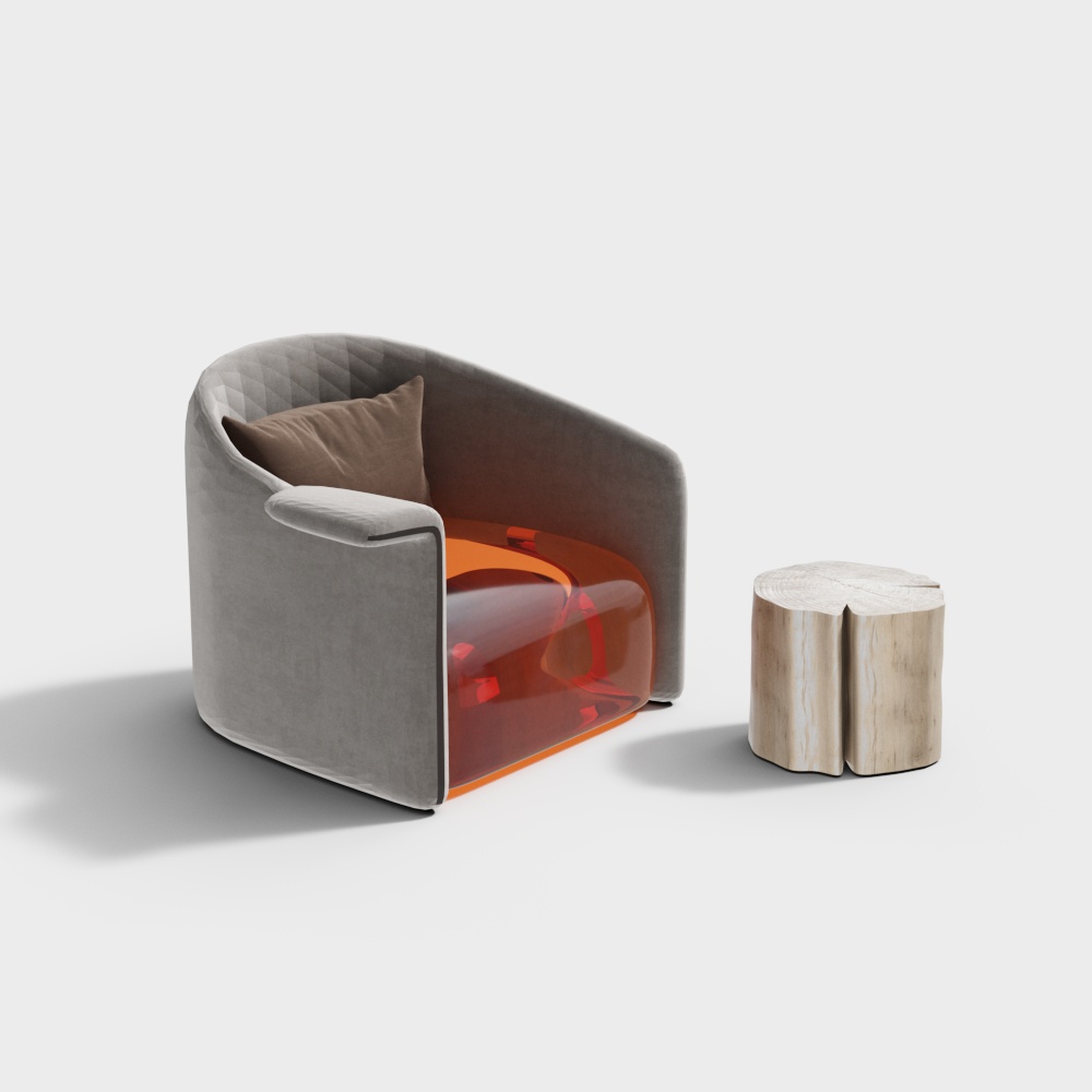 Grey velvet armchair with orange base and brown pillow next to wood stool on white background