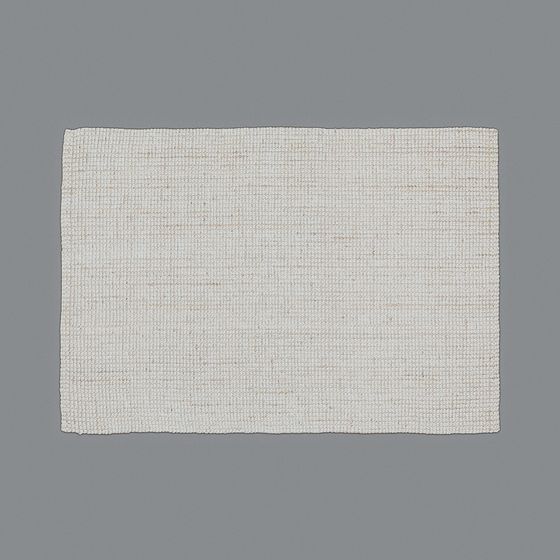 Rectangular cream woven area rug with textured surface and natural fiber look on grey background