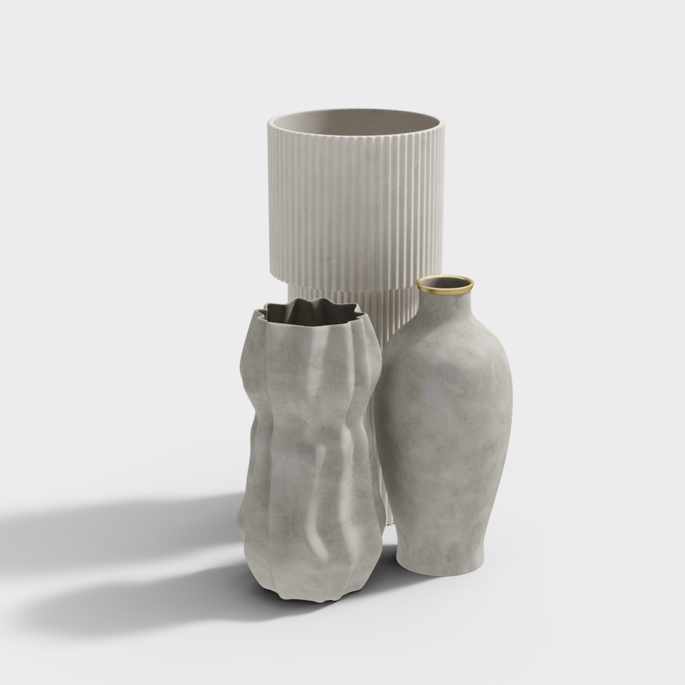 Three grey concrete vases with ribbed and wavy textures and gold rim on white background