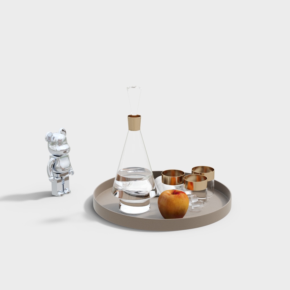 Beige round tray with glass decanter and gold rim glasses on white background