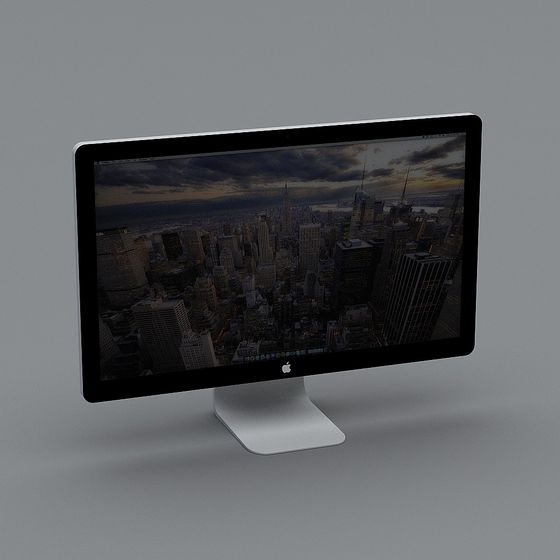 Modern silver desktop computer with black screen showing city view on grey background