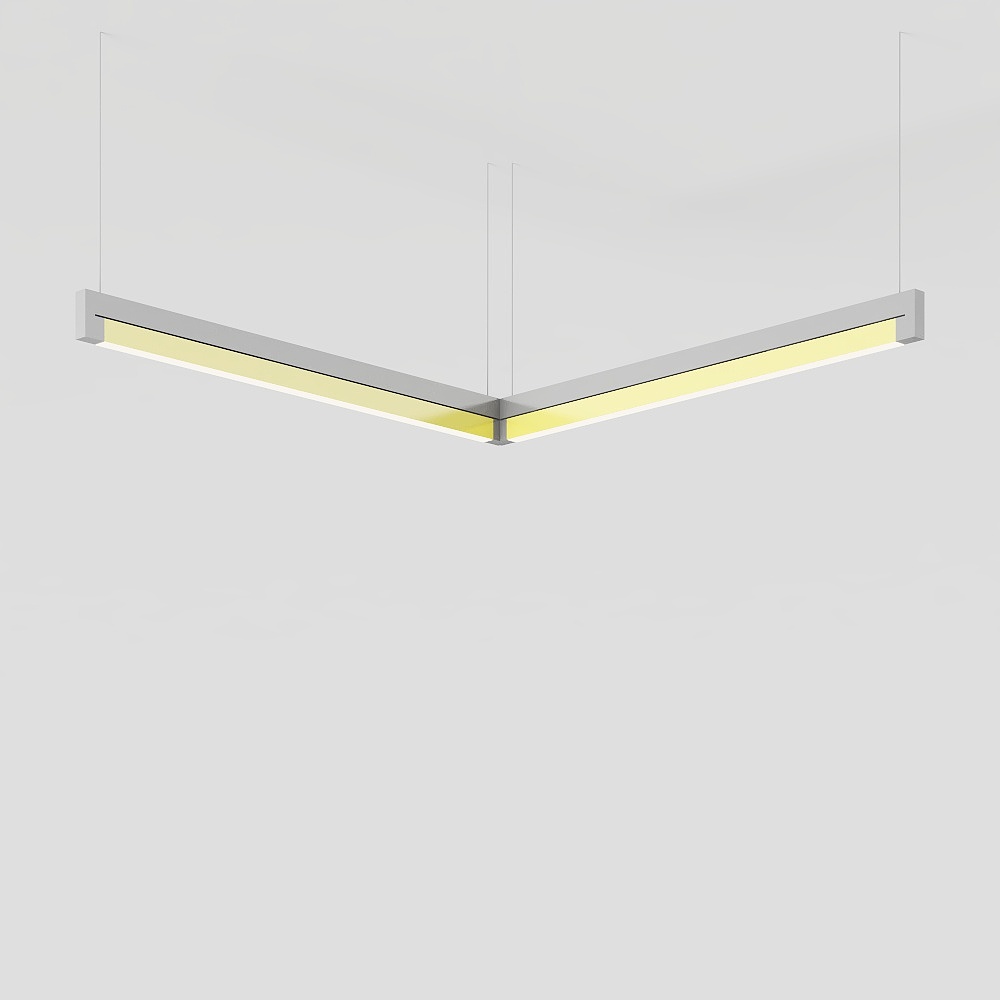 Modern v shaped ceiling light with silver frame and warm yellow glow on grey background