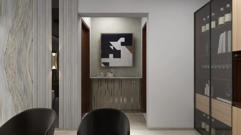 Modern hallway with abstract wall art gold console table and tall glass display cabinet design