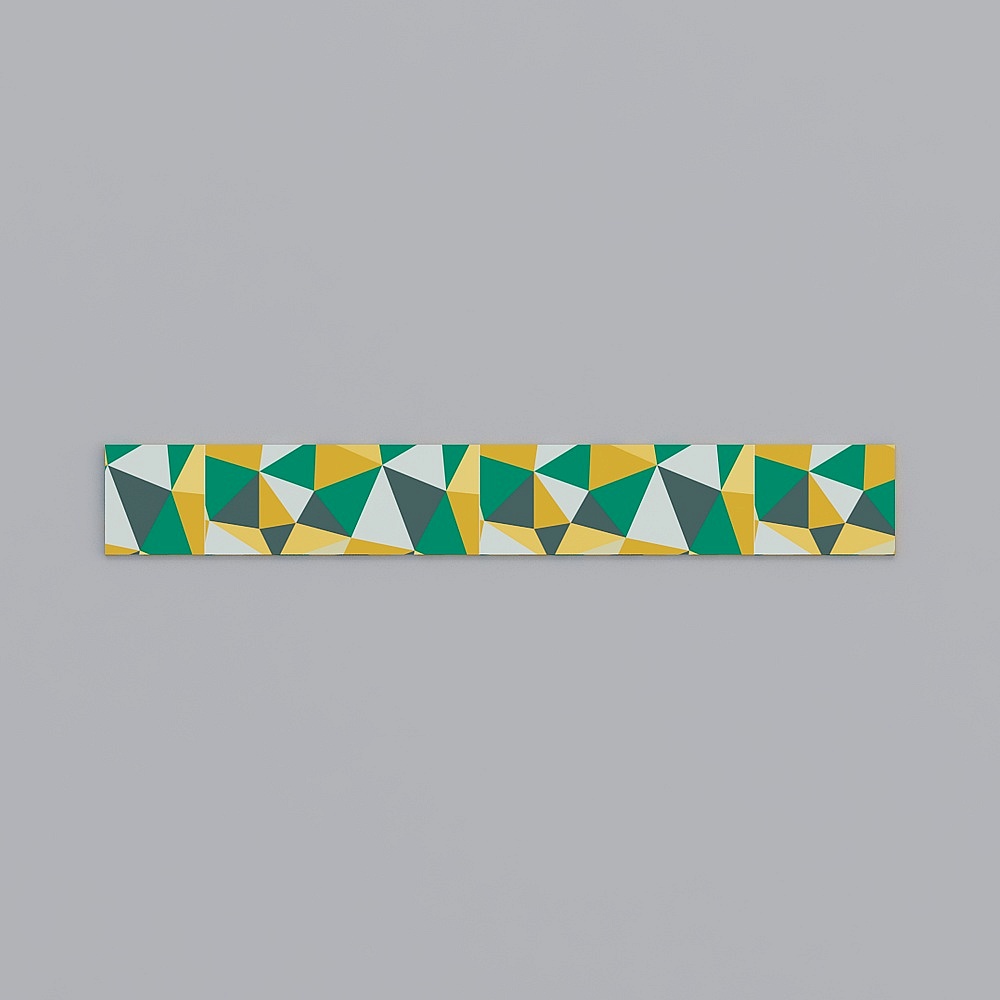 Long decorative wall tile with green yellow and grey geometric triangles on grey background