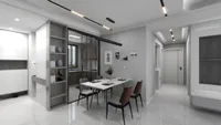 Dining room with marble table grey walls shelf unit and glass door leading to kitchen