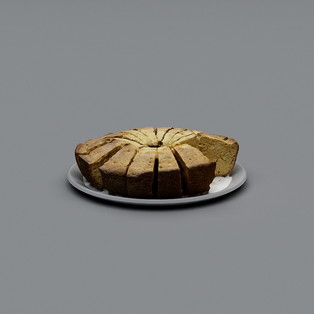 Sliced golden brown ring cake on a white plate on grey background