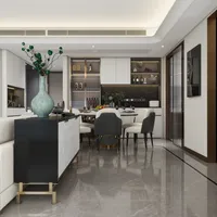 Black storage cabinet with blue vase in foreground overlooking modern dining room with white chairs