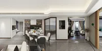 Wide open living space showing white sofa, dining table with chairs, cabinets, and glass doors