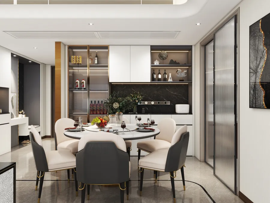 Modern dining area with round marble table, black chairs, white cabinets, wine storage, and floor