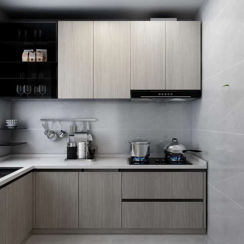 Modern kitchen with grey wood cabinets white stone countertop gas stove and a coffee machine
