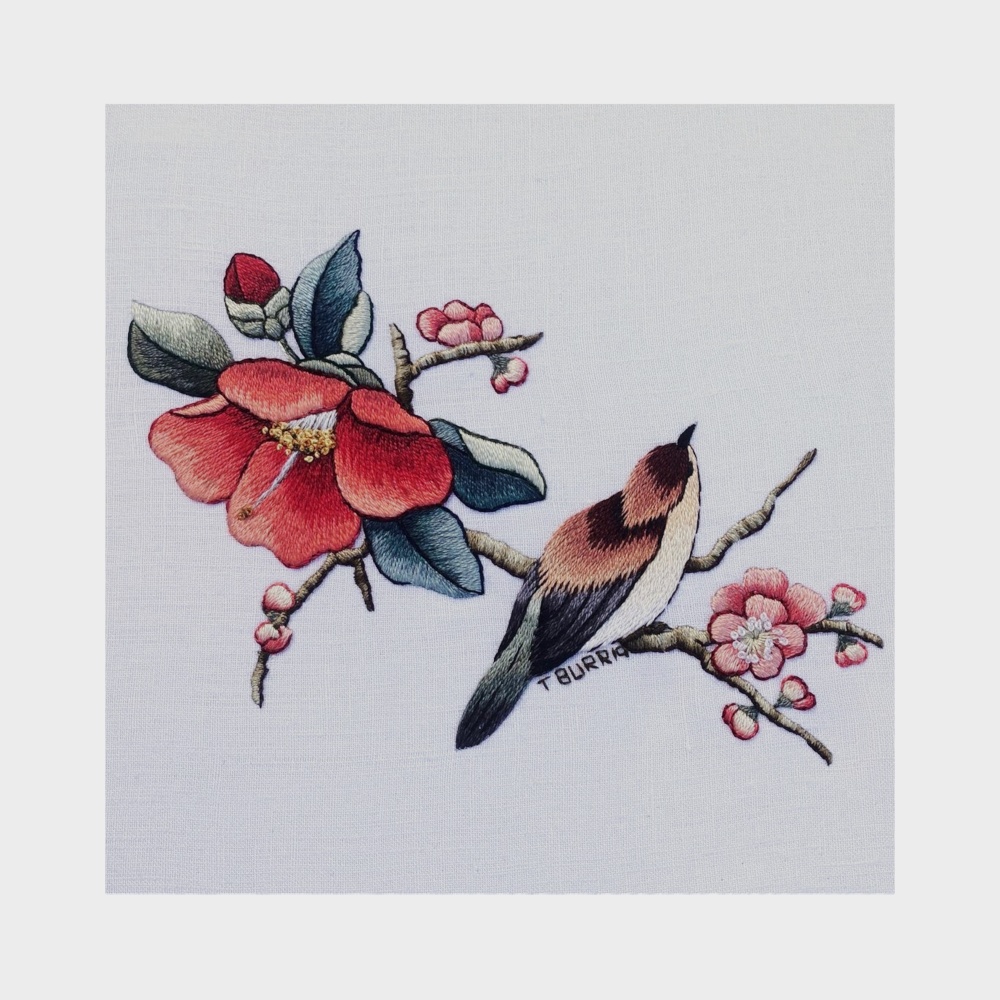 Broderie d'oiseaux et de fleurs