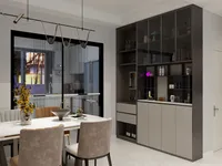 Modern dining area with marble table, velvet chairs, large grey storage cabinet, and glass door