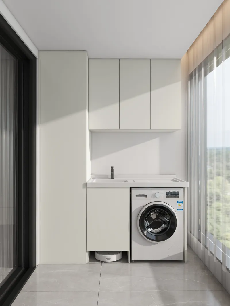 White laundry balcony with modern cabinets, a sink, washing machine, and a small robot vacuum