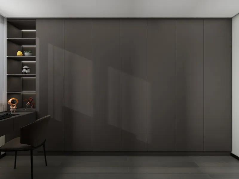 Modern dark gray cabinet wall with desk and open shelves showing toys and soft light