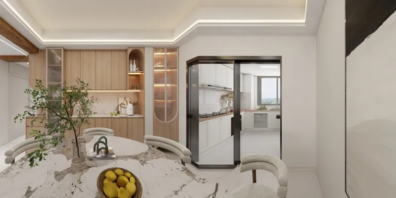 Modern dining room with marble table, yellow lemons, green plant, wooden cabinets, and ceiling lights