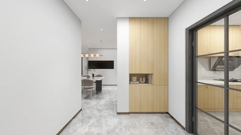 Modern hallway with white walls, marble flooring, wooden cabinet, glass door, and a dining area