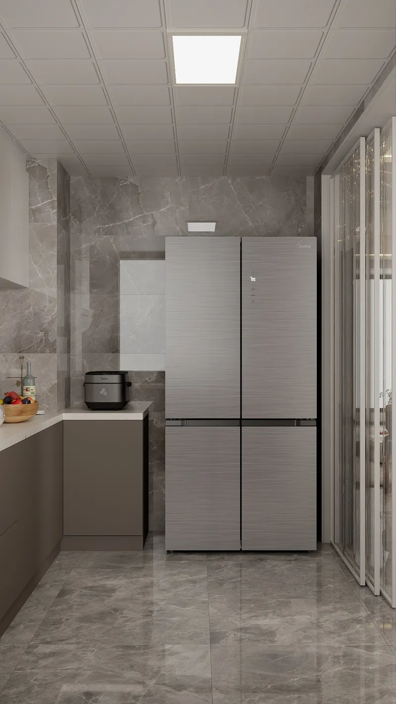 Modern kitchen area with large grey refrigerator marble wall tiles brown cabinets and ceiling light