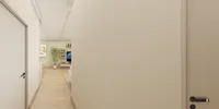 Interior design drawing showing hallway with wooden floors leading to living room with green walls