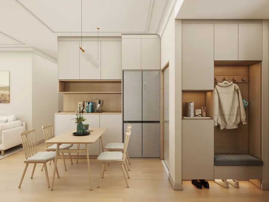Modern dining room featuring wooden table four chairs silver fridge white cabinet and coat storage
