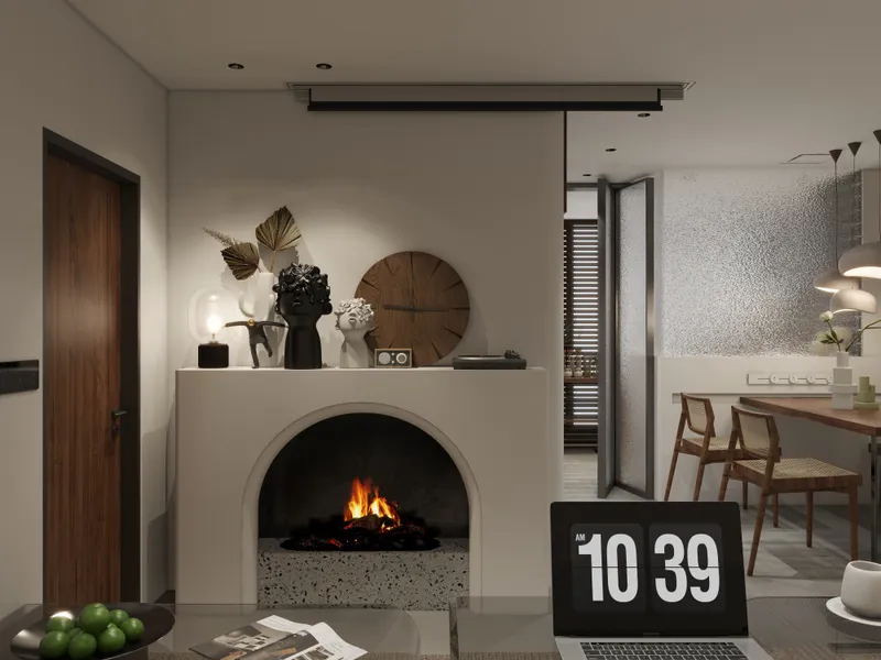 Modern living room featuring a warm fireplace with decorative sculptures and a dining area nearby