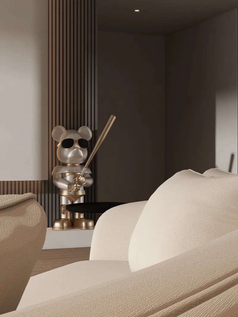 Silver bear statue holding baseball bat and sunglasses next to brown wall panel and sofa
