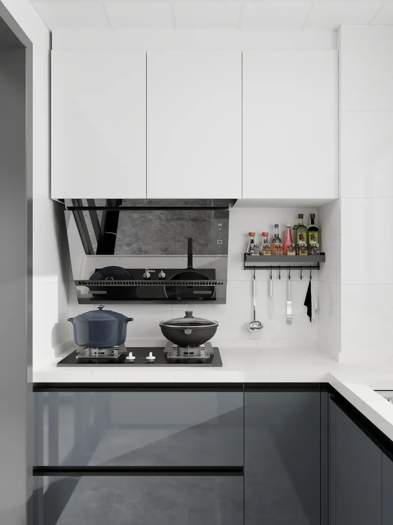 Modern kitchen with white cabinets, dark grey lower cabinets, gas stove, pots, and spice rack