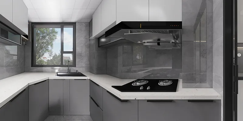 Modern kitchen design with grey cabinets white stone countertop black gas stove and window view