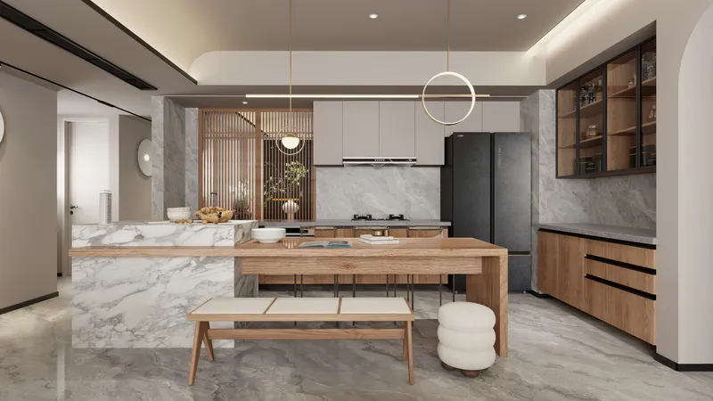 Modern kitchen featuring marble island wooden dining table white bench and two gold ceiling lights