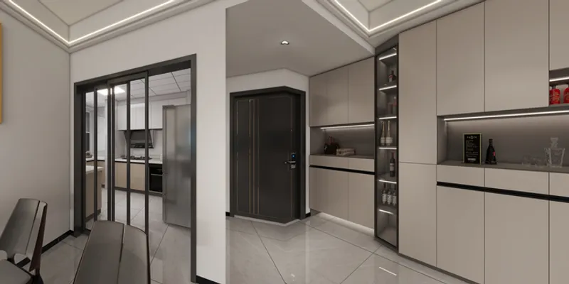 Modern home entryway with beige storage cabinets, black front door, and glass sliding kitchen doors