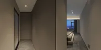 Modern hallway showing minimalist bedroom with gray wall panels, marble floor, bed, and city window