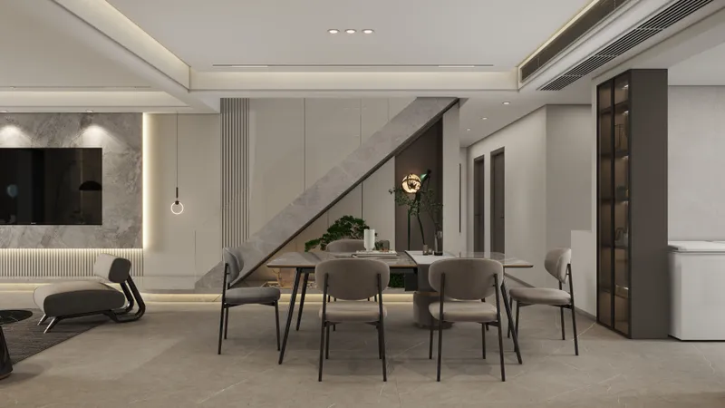 Modern dining room featuring grey chairs, marble table, television on wall, and integrated staircase design