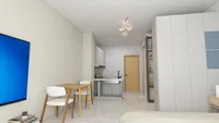 Small apartment interior with wooden dining table white chairs kitchen area and large white wardrobe