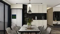 Modern dining room featuring marble table with grey chairs plus cream cabinets and black shelf
