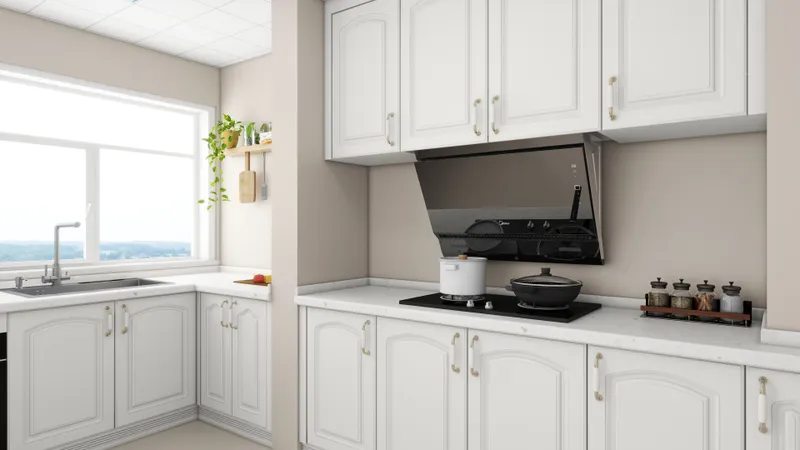 Modern white kitchen cabinets with black stove hood plus marble countertop and big window view