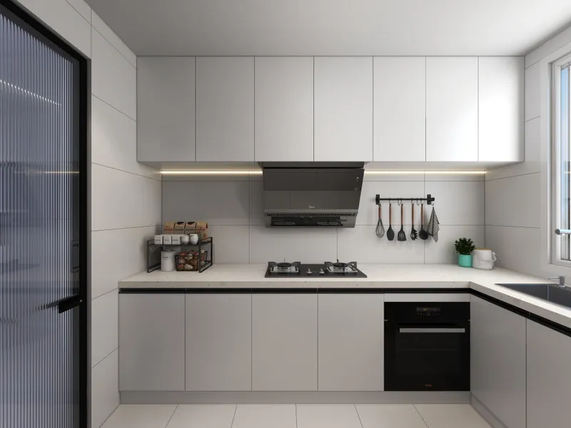Modern white kitchen with gas stove black range hood white cabinets sink and glass door