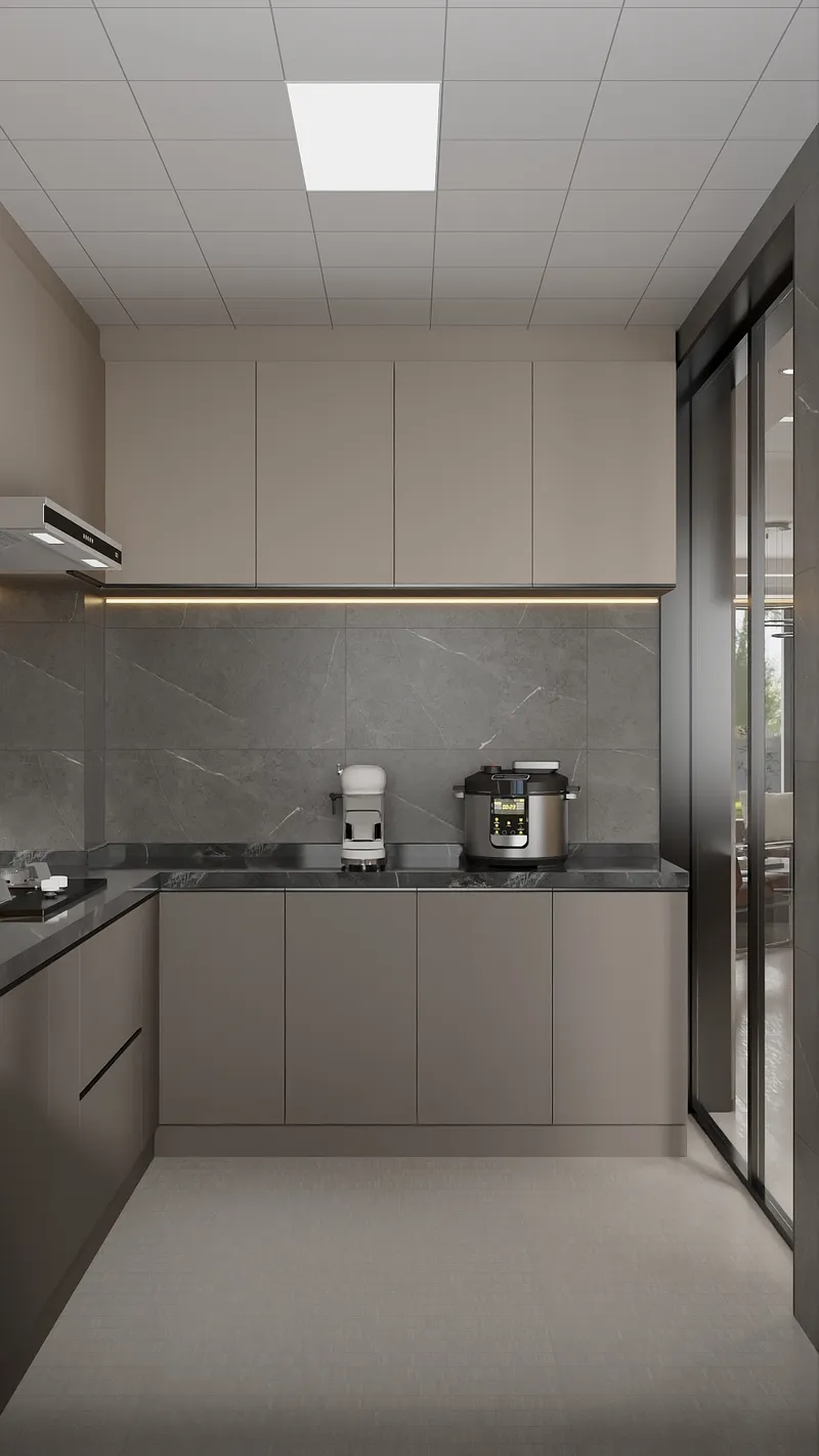 Modern kitchen with beige cabinets, grey stone backsplash, black countertop, coffee machine, and rice cooker