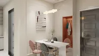Cream dining room featuring marble table, pink chairs, abstract wall art, orange niche, and door