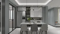 Modern dining room with marble table, grey chairs, white cabinets, large refrigerator, and ceiling light