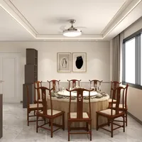Large round dining table with wooden chairs and ceiling fan light in a bright room