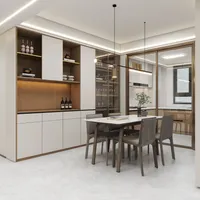 Modern dining room with white table grey chairs large wall cabinet and minimalist glass door