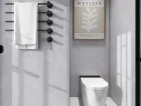 Modern grey bathroom design featuring white toilet black towel rack with towel and wall art