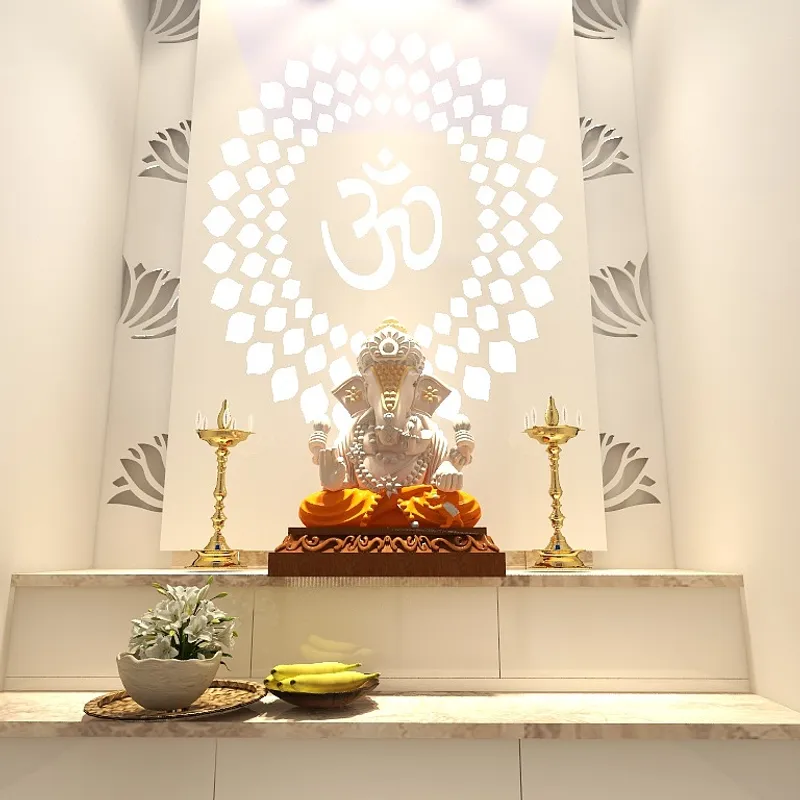 Ganesha statue in prayer room with glowing Om symbol gold light fixtures and white flowers