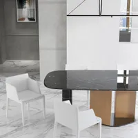 Modern dining area featuring black marble table, white chairs, marble floor, and light wood legs