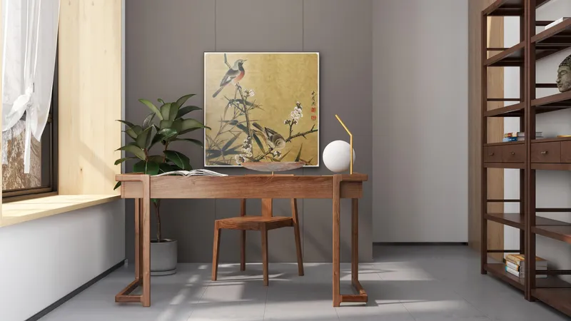 Wooden desk and chair near a bird wall painting green plant and tall wooden bookshelf
