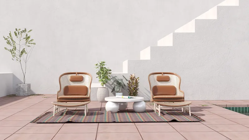 Outdoor patio with two woven chairs footrests white coffee table colorful rug and white staircase